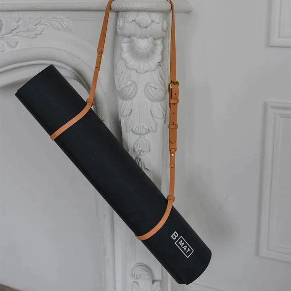 B YOGA Vegan Mat Strap with mat hanging on bolster